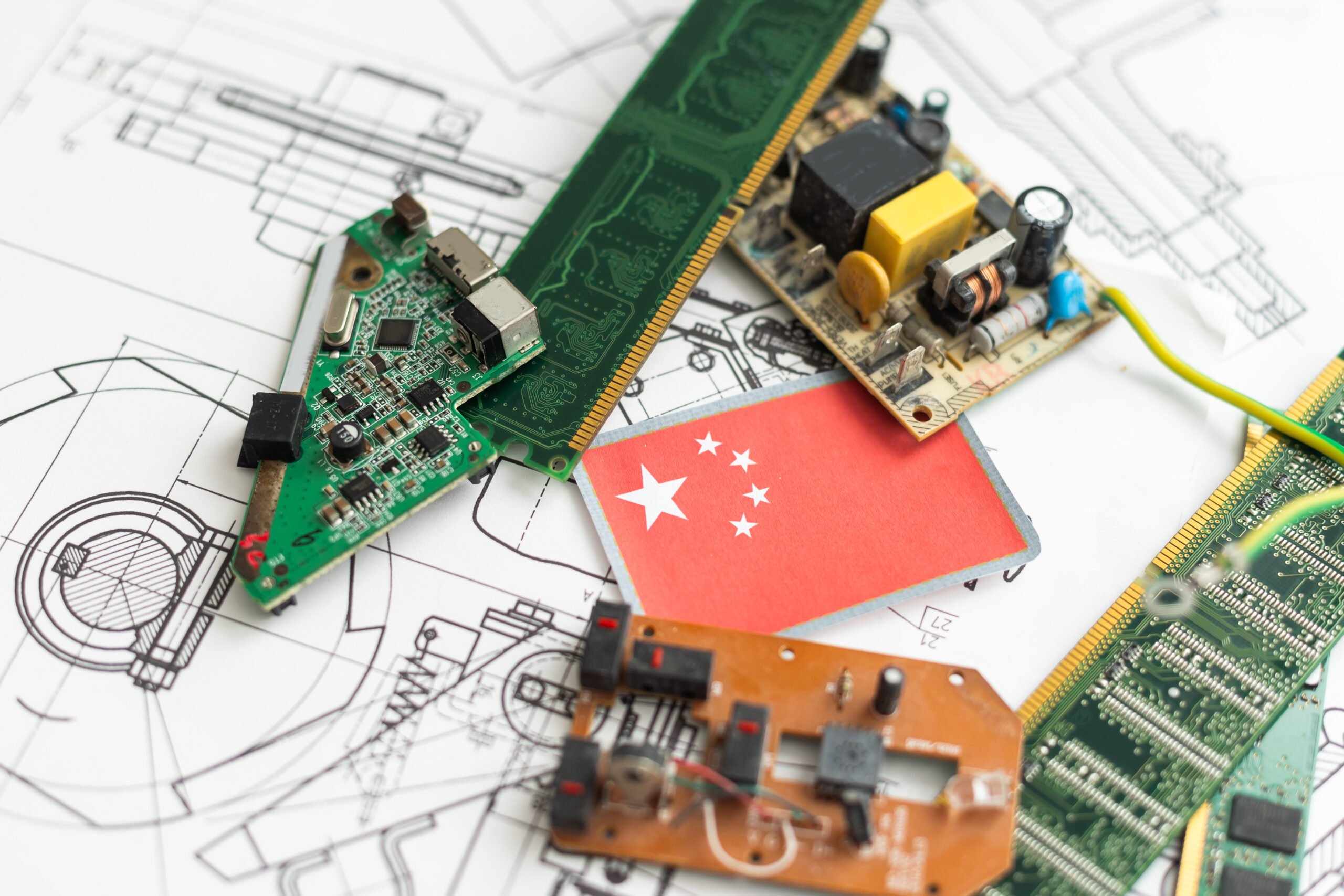 Group of electronic components with schematics in the background. High quality photo